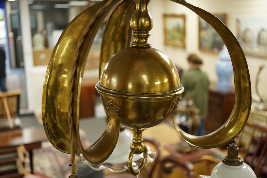 A late 19th century decorative brass, three branch hanging light, with fluted glass shades, 63cm high